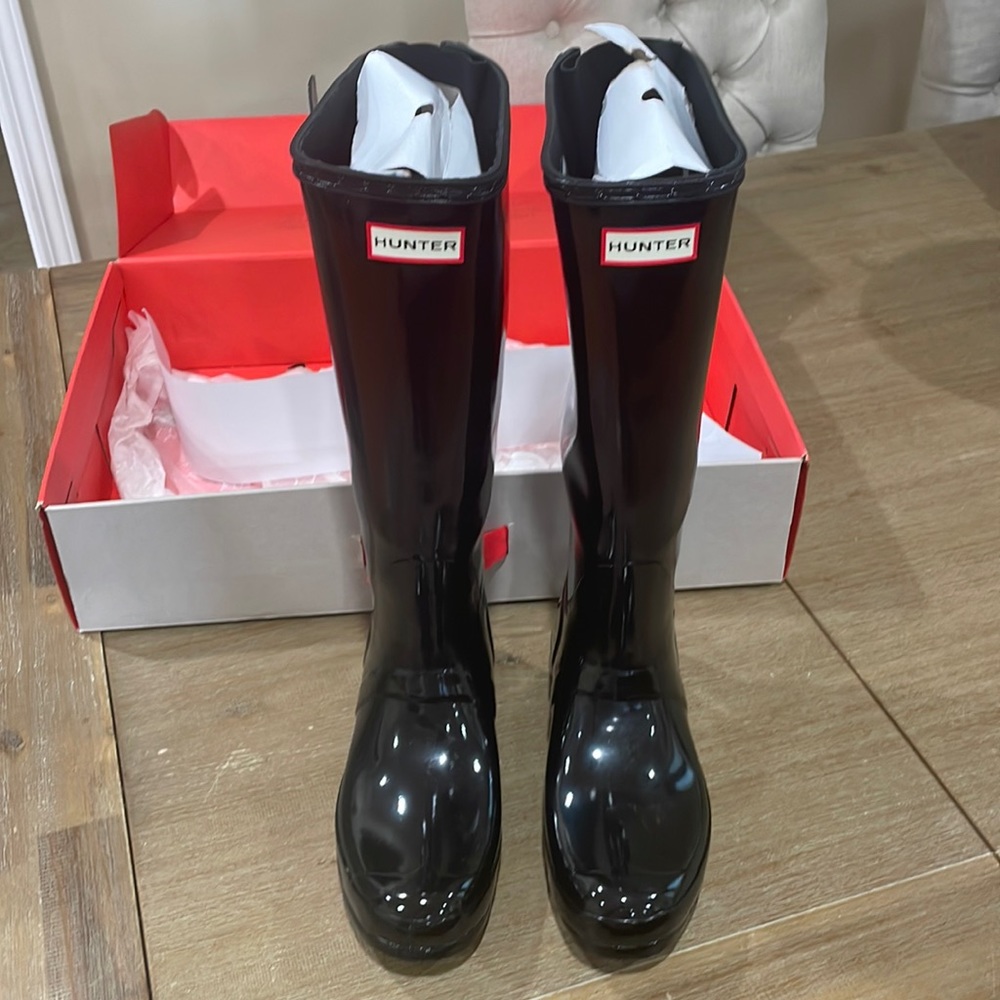 Hunter rain boots with adjustable strap and with soft socks to wear inside.